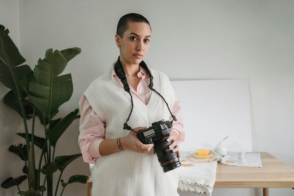 REAL ESTATE PHOTOGRAPHER WITH CAMERA